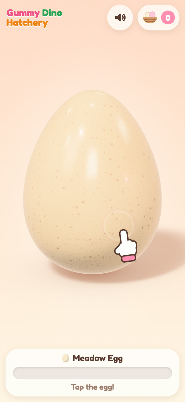 A speckled candy egg waiting to be tapped, with a little hand showing where to tap